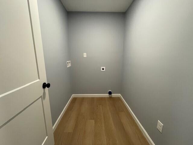 washroom featuring washer hookup, wood-type flooring, and hookup for an electric dryer