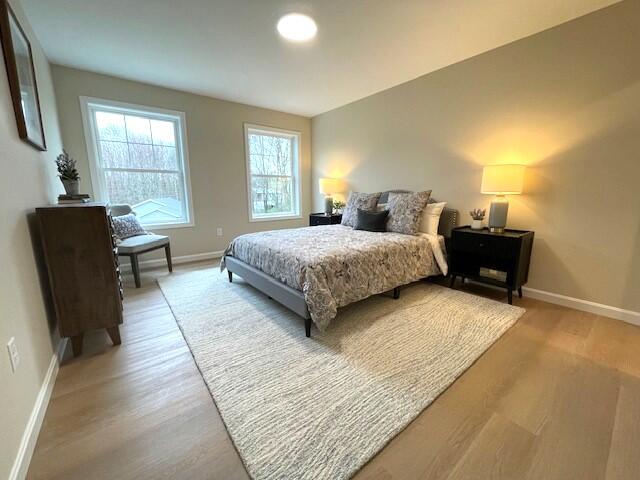 bedroom with hardwood / wood-style floors