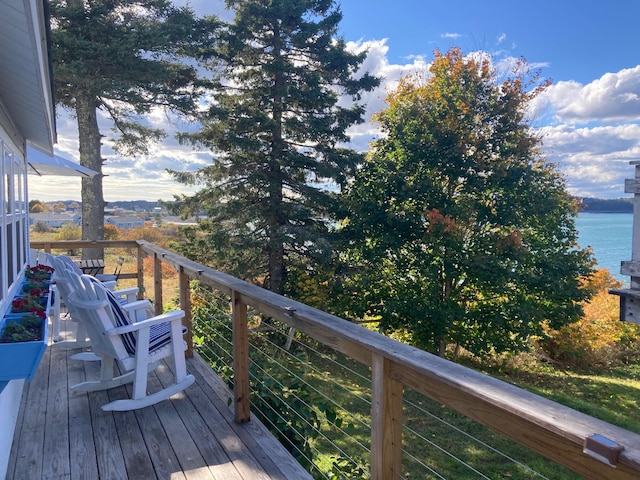 wooden deck with a water view