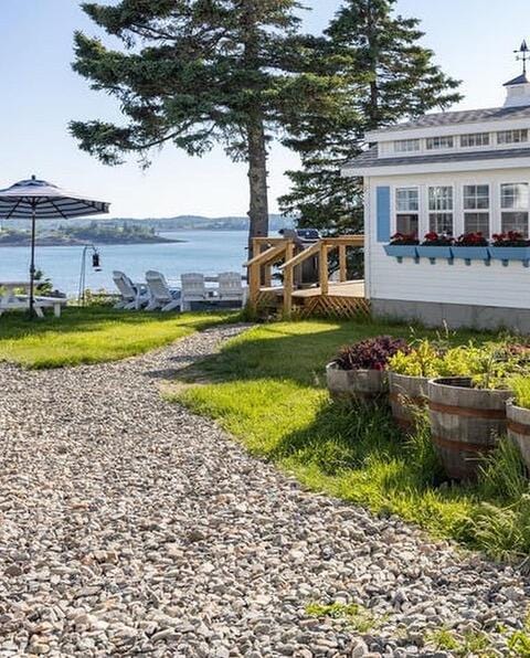 exterior space with a deck with water view