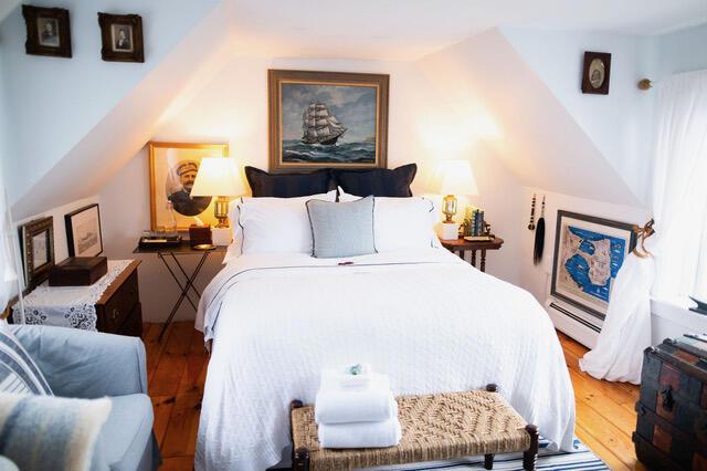 16 Monument St, Lubec, ME 04652 - bedroom featuring wood finished floors and a baseboard radiator