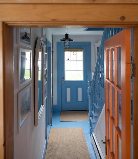 16 Monument St, Lubec, ME 04652 - doorway to outside with stairs and a baseboard radiator