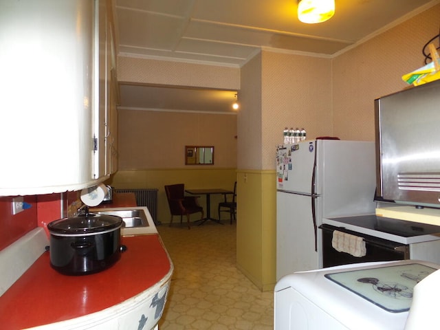 kitchen featuring washer / dryer