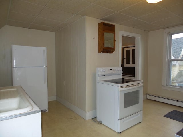 kitchen featuring baseboard heating, a paneled ceiling, and white appliances