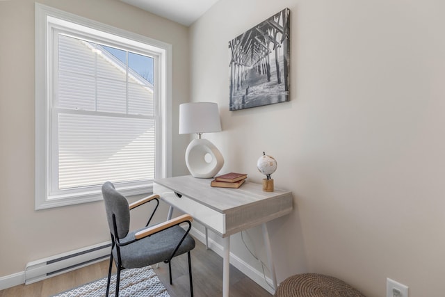 home office with wood finished floors and baseboards