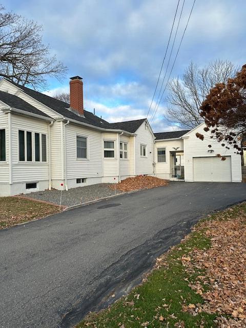 view of property exterior with a garage