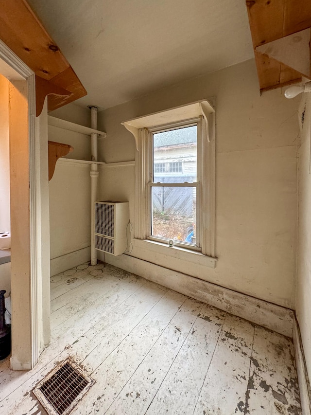 bonus room with a wall unit AC