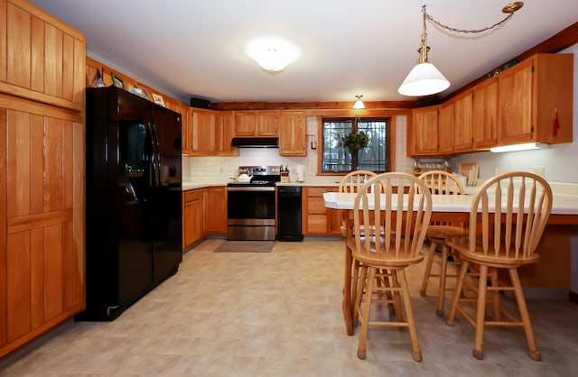 kitchen with black fridge with ice dispenser, backsplash, stainless steel electric range oven, and pendant lighting