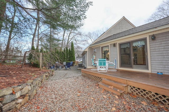 wooden deck with a patio