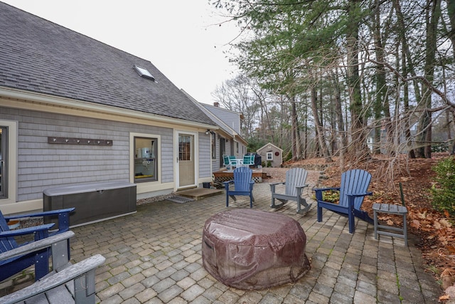 view of patio / terrace featuring a storage shed