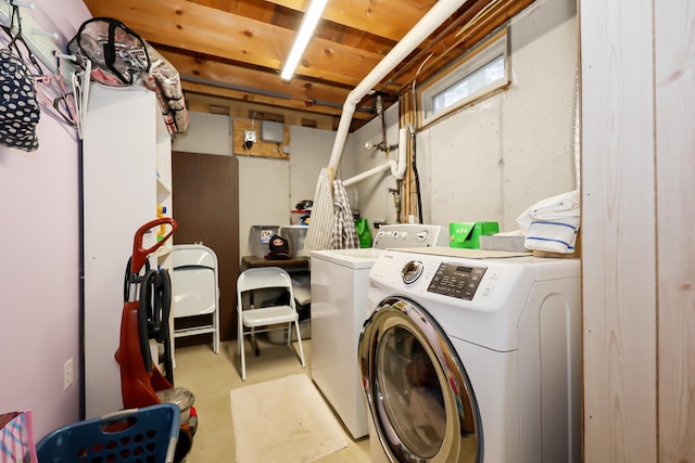 clothes washing area with independent washer and dryer