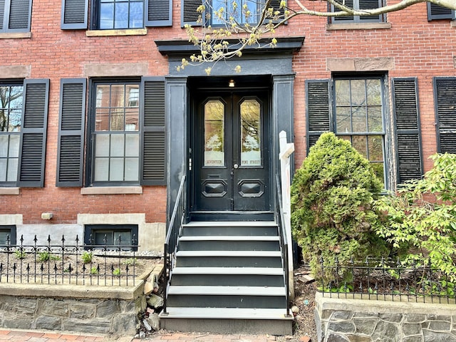 17 Pine St, Portland, ME 04102 - view of exterior entry featuring french doors and brick siding