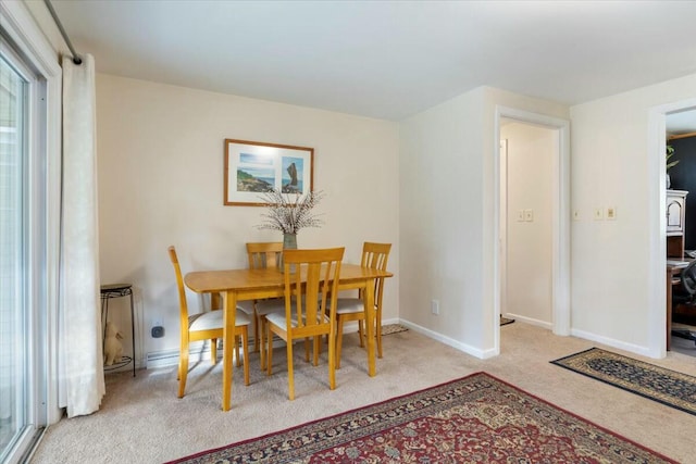 dining area with light colored carpet