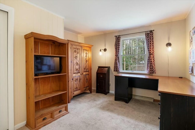 carpeted office featuring built in desk and ornamental molding