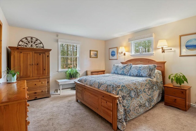 bedroom featuring light colored carpet