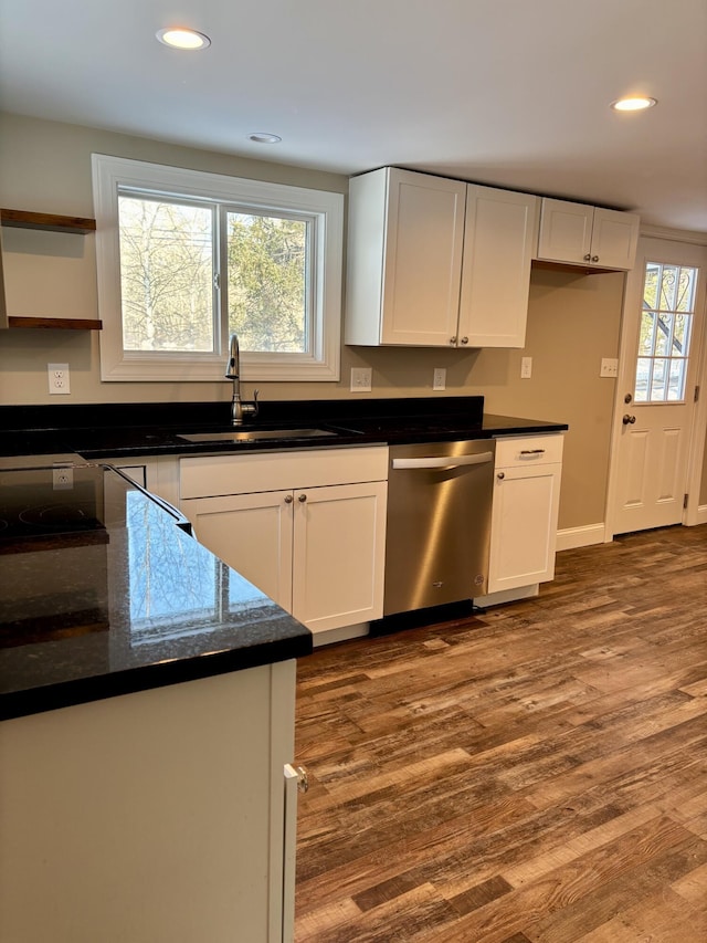 kitchen featuring dishwasher, a sink, white cabinetry, and dark wood-style floors