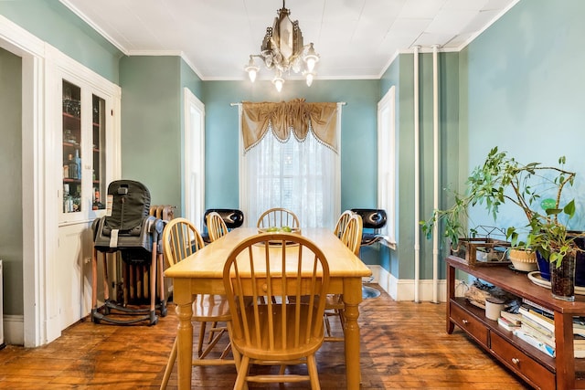 363 Broadway, Bangor, ME 04401 - dining space featuring dark wood-type flooring, a chandelier, and crown molding