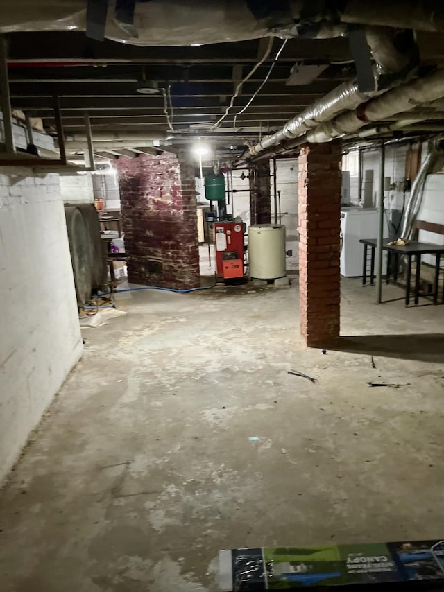363 Broadway, Bangor, ME 04401 - unfinished below grade area featuring washer / dryer, water heater, and heating fuel