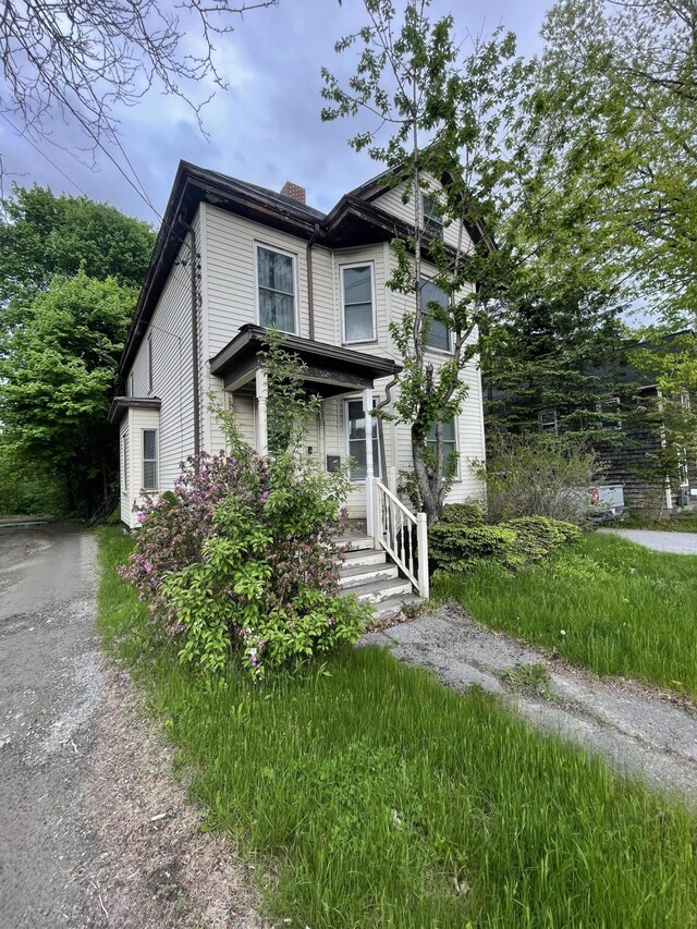 363 Broadway, Bangor, ME 04401 - view of front of property with a chimney and covered porch