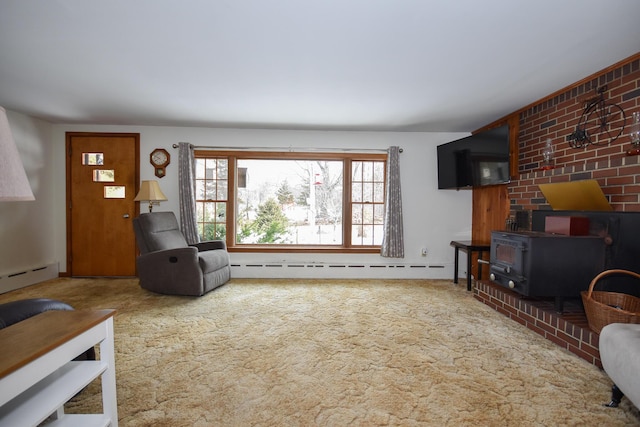 carpeted living room with a baseboard radiator and a wood stove