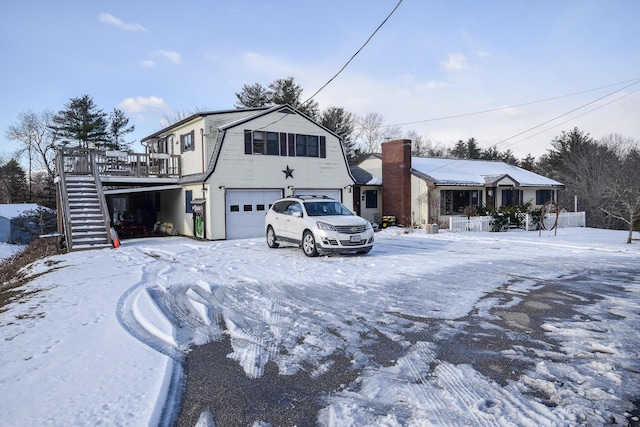 front facade featuring a garage and a deck