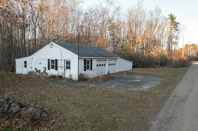 view of side of property featuring a garage