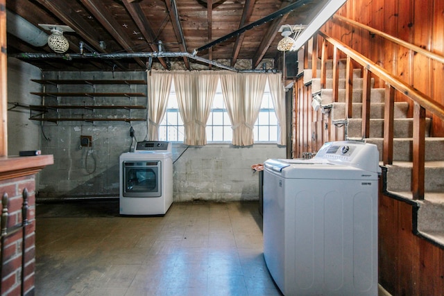 clothes washing area featuring separate washer and dryer