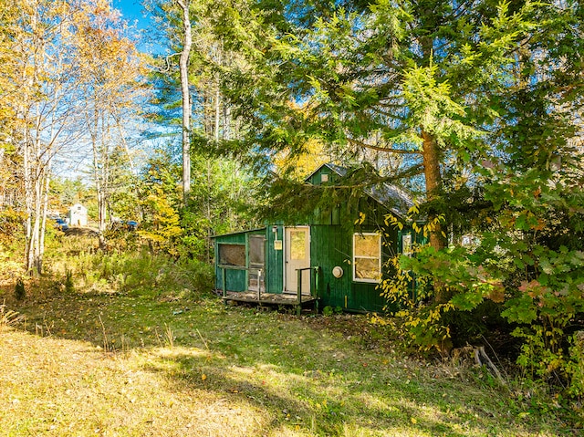 view of outbuilding with a yard