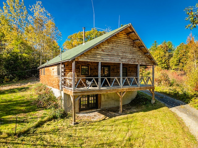 rear view of house with a lawn