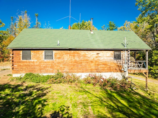 view of home's exterior with a lawn