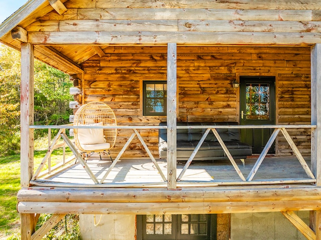 wooden terrace with a porch