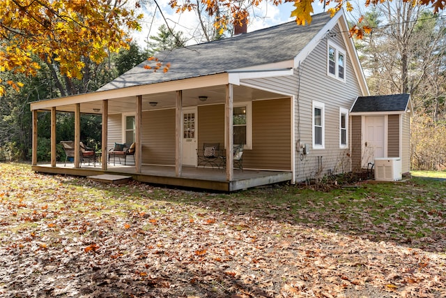 exterior space featuring covered porch and a storage unit