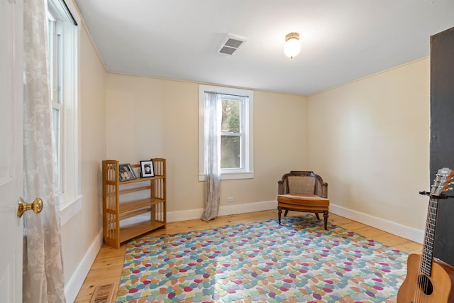 sitting room with light hardwood / wood-style floors