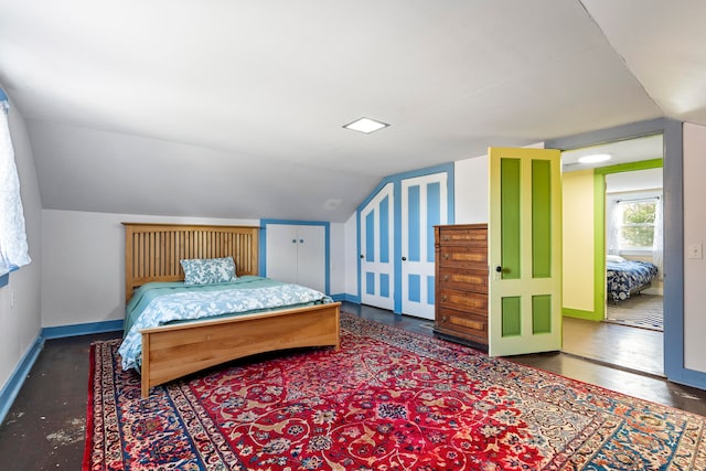 bedroom with lofted ceiling