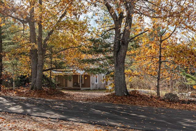 obstructed view of property featuring covered porch