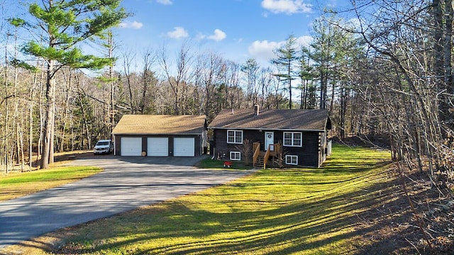 view of front facade featuring a front lawn and a garage