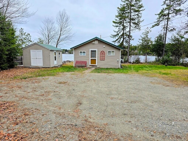 view of front facade with a storage unit