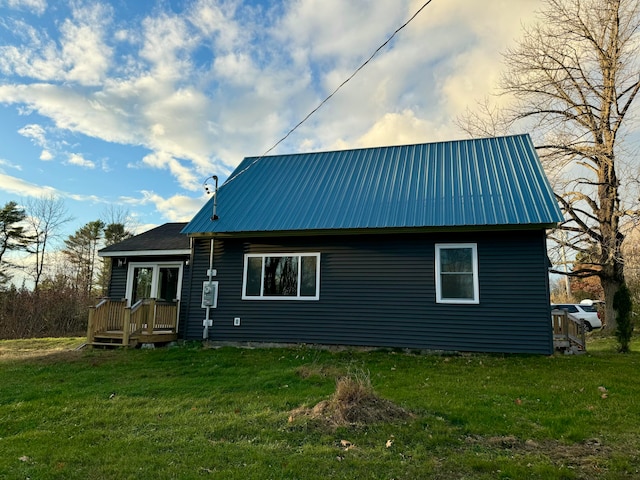 back of property with a lawn