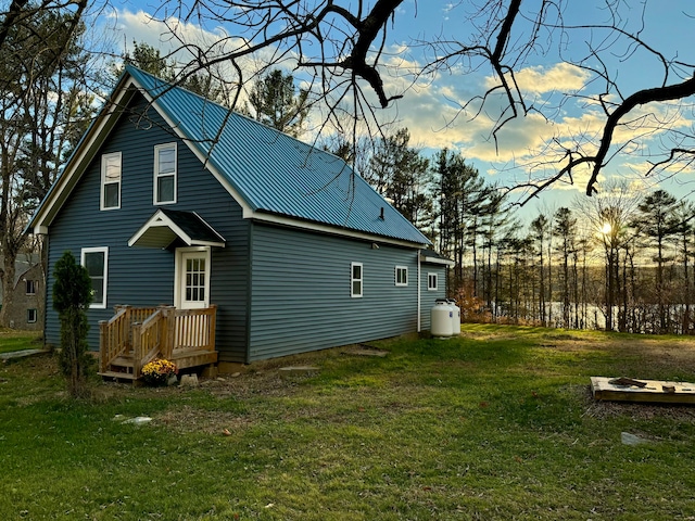 rear view of house with a yard