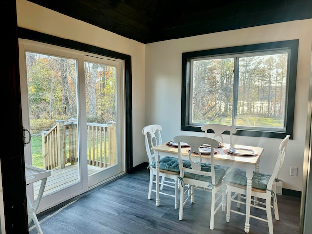 dining space with wood-type flooring