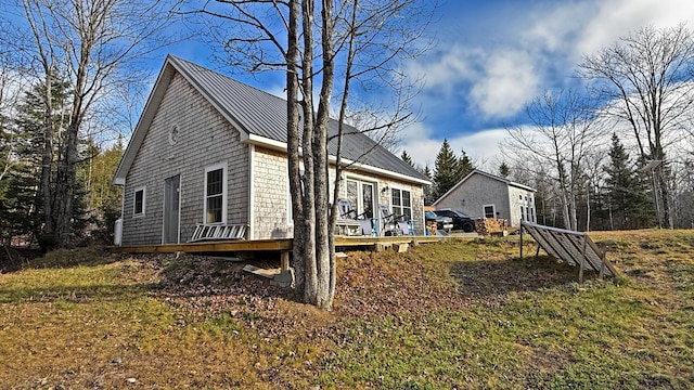 10 Bog Brook Way, Cutler, ME 04626 - view of side of property featuring metal roof, a wooden deck, and a standing seam roof