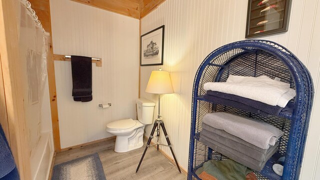 10 Bog Brook Way, Cutler, ME 04626 - full bathroom featuring wood finished floors, toilet, baseboards, and curtained shower