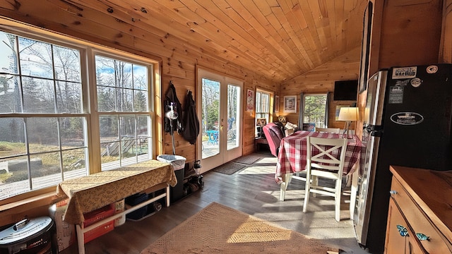 sunroom with a wealth of natural light, french doors, wood ceiling, and lofted ceiling