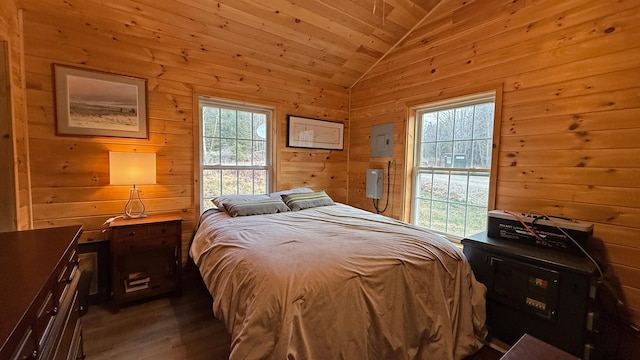 bedroom featuring lofted ceiling, electric panel, wooden walls, dark hardwood / wood-style flooring, and wood ceiling