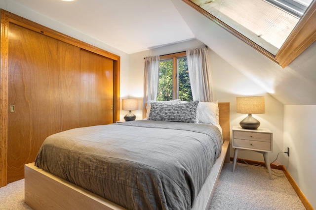 bedroom featuring carpet flooring and vaulted ceiling