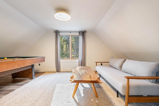 living area featuring lofted ceiling, wood-type flooring, and pool table