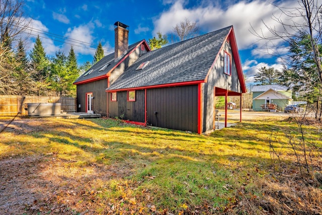 rear view of house with a lawn