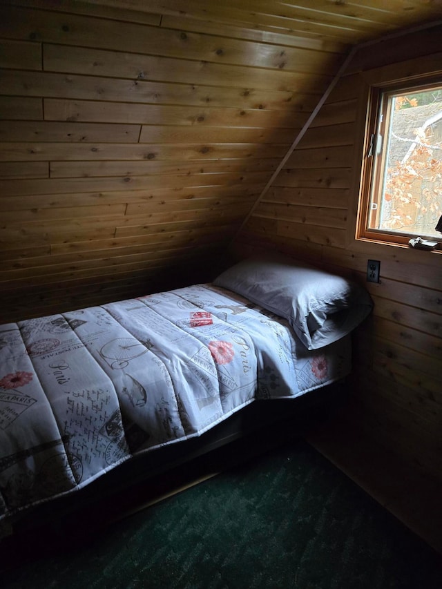 carpeted bedroom featuring wood walls, wood ceiling, and lofted ceiling