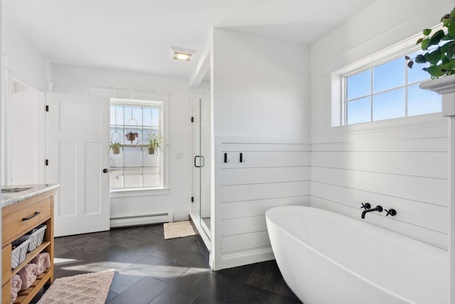 bathroom featuring shower with separate bathtub, vanity, a baseboard radiator, and a wealth of natural light