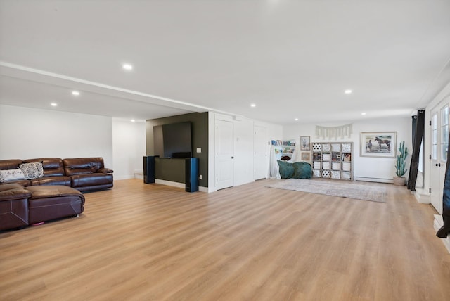 living room featuring light hardwood / wood-style floors and baseboard heating